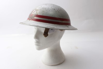 Lot 227 - Second World War British Military MKII Steel Helmet with silver painted finish and Essex Fire Brigade badge to front, with chinstrap and liner.
