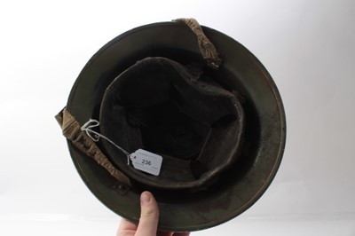 Lot 236 - Second World War British Military MKII Steel Helmet with camouflage painted finish and Gurkha formation  badge to sode, with chinstrap and liner. Dated 1939 under brim