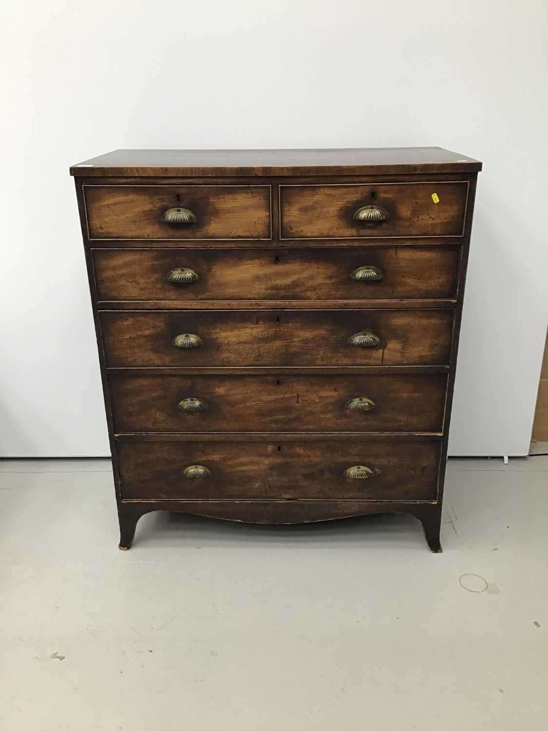 Lot 47 - George III mahogany chest of two short and four long graduated drawers with later brass cup handles