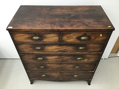 Lot 47 - George III mahogany chest of two short and four long graduated drawers with later brass cup handles