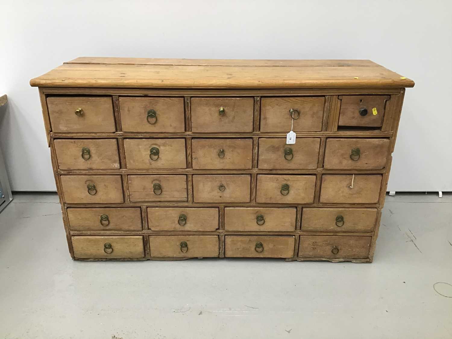 Lot 19 - 19th century pine apothecary's chest of 23 drawers