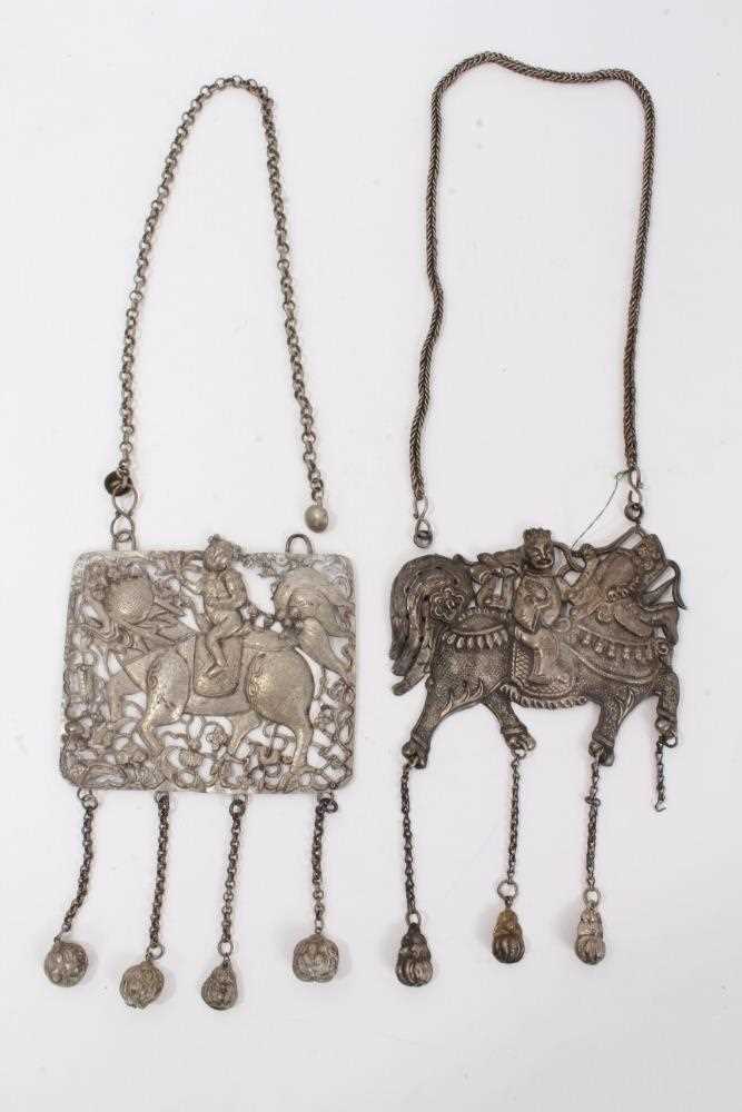 Lot 82 - Two Old Chinese white metal necklaces with embossed plaque depicting a figure on a dragon/horse