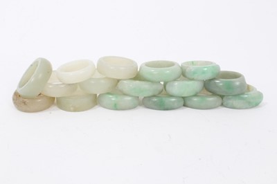 Lot 89 - Collection of 16 Chinese polished green hard stone/ jade rings