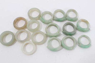 Lot 89 - Collection of 16 Chinese polished green hard stone/ jade rings