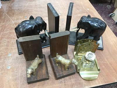Lot 115 - Pair of cold painted metal mounted book ends, together with pair of African ebony books