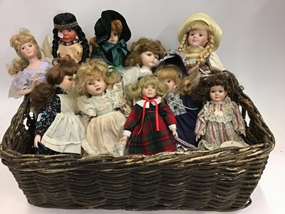 Lot 1575 - Assorted modern dolls in wicker basket