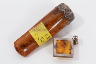 Lot 114 - Large silver mounted amber pendant on silver chain, one other amber pendant and amber cheroot