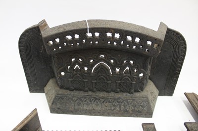 Lot 1895 - Three miniature Victorian ornamental cast iron fireplaces, a cast iron front plate, ash pan front and miniature front (6)