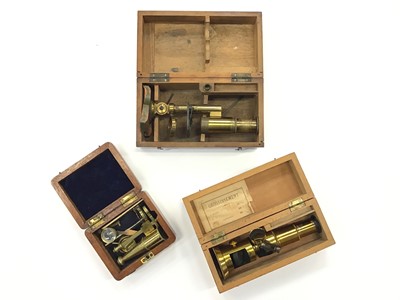 Lot 2024 - Three Miniature Antique Brass Microscopes in wooden cases