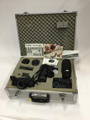 Lot 976 - Canon T70 camera with a Tamron zoom lens, Canon zoom lens, two other lenses and accessories in case