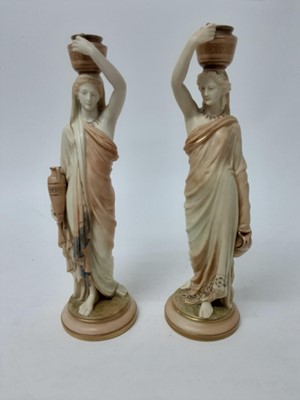 Lot 558 - Pair of Royal Worcester Blush Ivory candlesticks In the form of female water carriers