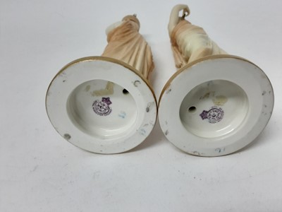 Lot 558 - Pair of Royal Worcester Blush Ivory candlesticks In the form of female water carriers