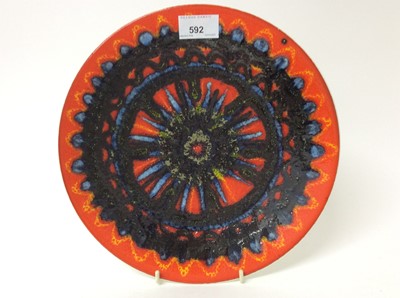 Lot 592 - Poole Delphis circular plate with abstract decoration on orange ground