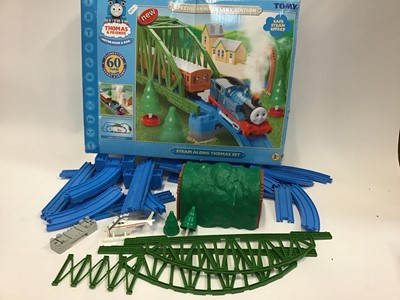 Lot 1546 - Railway Ertl and Gullane (Hornby) Approximately 50 Trains, Trucks, Carriages, Chinese Dragon, Bi-Plane, Fat Controller, 12 Vehicles, Harold Helicopter includes Gold and Electric Blue Thomas. Plus T...