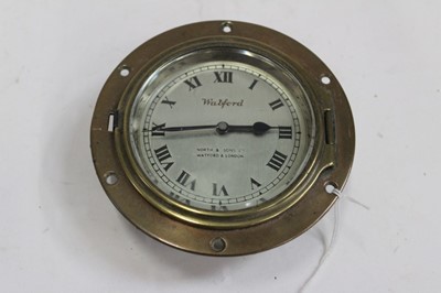 Lot 2007 - Brass cased ships bulkhead clock with silvered dial marked Watford, by North & Sons Ltd, Watford & London