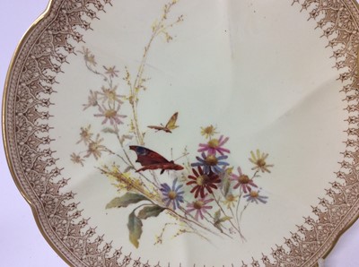 Lot 631 - Three Royal Worcester blush ivory dishes decorated with insects and flowers, 22cm diameter