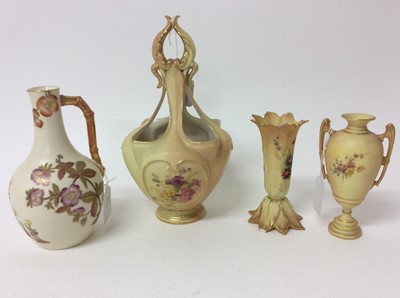 Lot 635 - Royal Worcester blush ivory wares, including a basket form vase, a twin-handled vase, a flower-form vase and a jug, 13.5cm to 25cm height