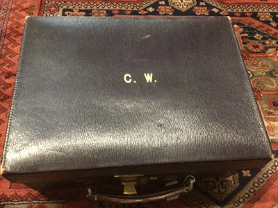 Lot 1828 - Early 20th Century Navy Blue leather travelling vanity case containing a selection of silver topped bottles, by Asprey & Co, with gilt monogram 'C. W.' to lid.