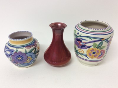 Lot 653 - Carters Poole red lustre vase c.1906 and two bluebird pattern Poole vases, the largest measuring 16cm height (3)