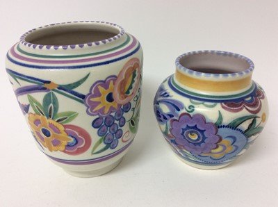 Lot 653 - Carters Poole red lustre vase c.1906 and two bluebird pattern Poole vases, the largest measuring 16cm height (3)