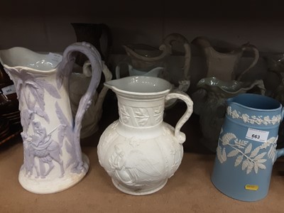 Lot 663 - Collection of sixteen Victorian relief moulded jugs, the largest measuring 31cm height