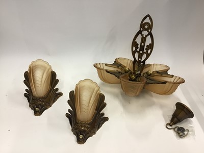 Lot 2000 - Art Deco ceiling light with matching pair of wall lights, yar oxidised and gilded cast metal fittings with cinnamon tinted glass scalloped shades