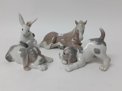 Lot 678 - Four Lladro porcelain animals - horse, rabbit and two dogs