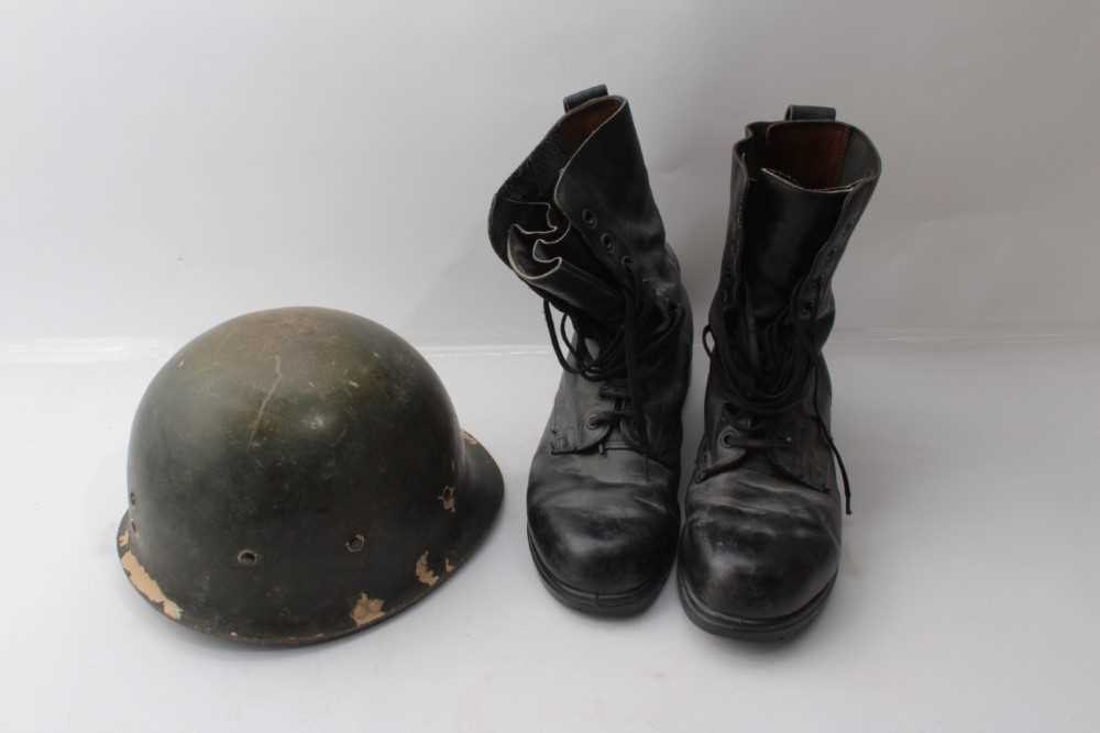 Lot 266 - Post War British Military helmet together with a pair of British Military issue boots (3)