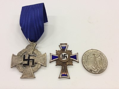 Lot 287 - Nazi Faithful Service Decoration (25 years) together with a Nazi Mothers' Cross and another Nazi medal (3)