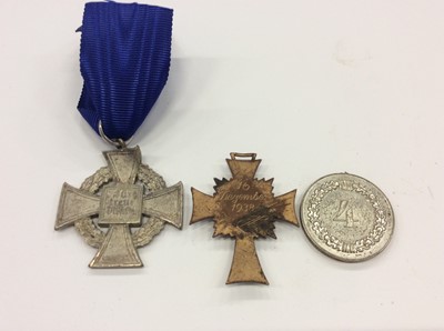 Lot 287 - Nazi Faithful Service Decoration (25 years) together with a Nazi Mothers' Cross and another Nazi medal (3)