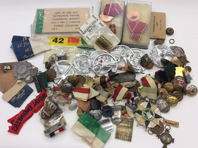 Lot 296 - Box containing a group of military buttons, badges and other Militaria
