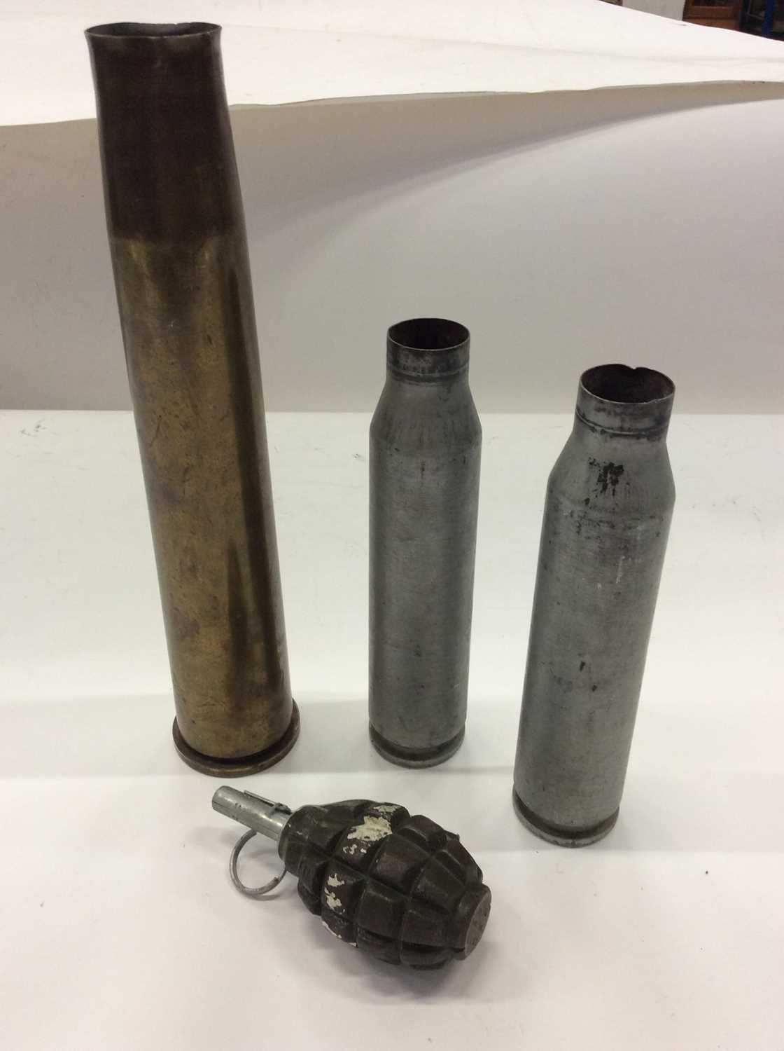 Lot 297 - Three shell cases, together with a