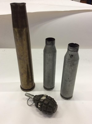 Lot 297 - Three shell cases, together with a deactivated Greanade