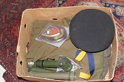 Lot 298 - One box of assorted Militaria to include uniforms, Military torches and plaques