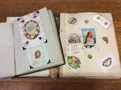 Lot 901 - Two albums of Victorian greeting cards, paper lace, silks, pop-ups etc