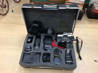 Lot 831 - Olympus OM-2 in hard case with lenses and accessories, including Olympus f/1.8 50mm, f/2.8 100mm, Tamron f/3.5-4.5 28-70mm, Tamron f/3.8 210mm lenses