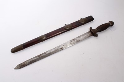 Lot 873 - Late 19th century Chinese Jian sword with engraved brass mounts, ribbed wood grip, straight double-edged blade in brass mounted scabbard, blade 41cm overall