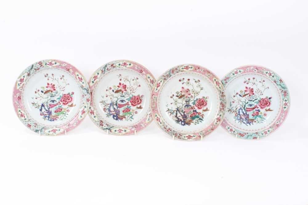 Lot 19 - Set of four 18th century Chinese famille rose export porcelain dishes, Yongzheng/Qianlong period, each painted with a floral pattern with central vase motif, the borders with floral patterns on geo...