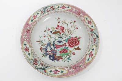Lot 19 - Set of four 18th century Chinese famille rose export porcelain dishes, Yongzheng/Qianlong period, each painted with a floral pattern with central vase motif, the borders with floral patterns on geo...