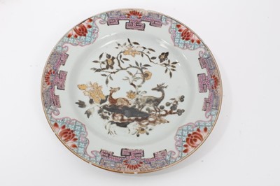 Lot 23 - Four 18th century Chinese famille rose porcelain dishes, including two painted with flowers, another painted en grisaille with two deer, and another with a watery landscape