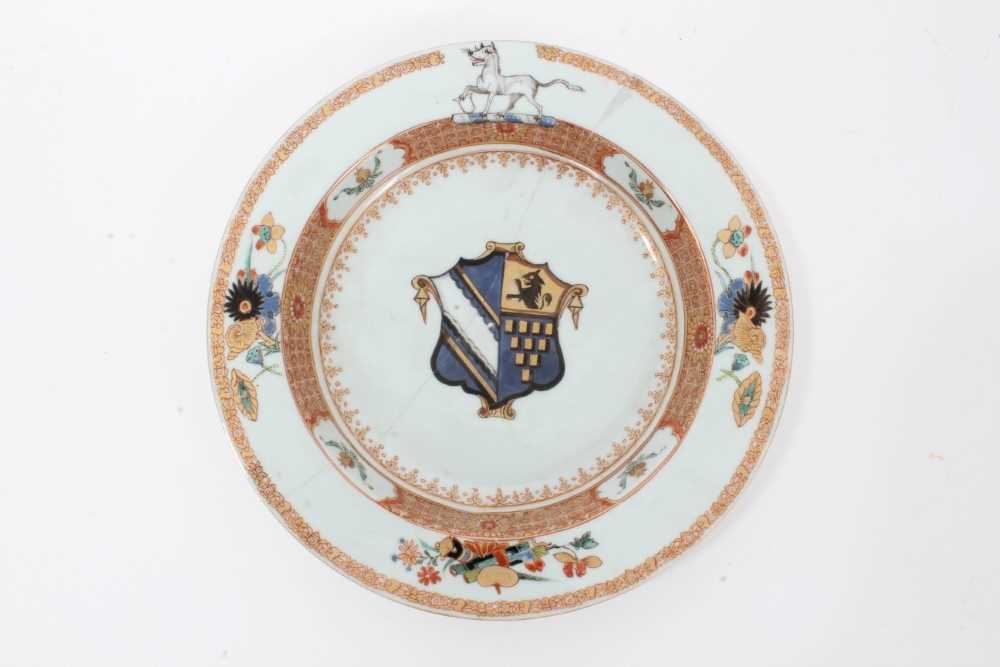 Lot 25 - Good quality 18th century Chinese famille rose armorial porcelain dish, the centre painted with coat of arms, surmounted by a hound on the border, with floral patterns and precious objects, 22.75cm...