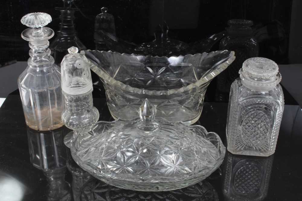 Lot 88 - Group of early 19th century cut glass, including a three-ring decanter with mushroom stopper, a square lidded jar, an unusual sugar caster with threaded top, an oval dish, and a further covered dis...