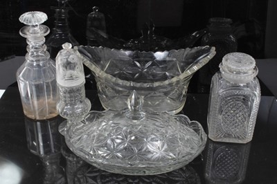 Lot 35 - Group of early 19th century cut glass, including a three-ring decanter with mushroom stopper, a square lidded jar, an unusual sugar caster with threaded top, an oval dish, and a further covered dis...