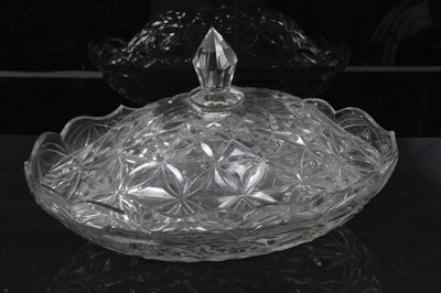 Lot 35 - Group of early 19th century cut glass, including a three-ring decanter with mushroom stopper, a square lidded jar, an unusual sugar caster with threaded top, an oval dish, and a further covered dis...