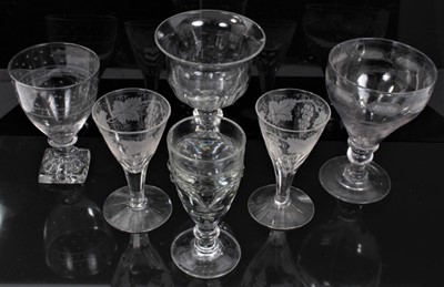 Lot 36 - Group of 18th and 19th century English glassware, including a cut glass goblet, two goblets with lemon squeezer bases, a further goblet, a pair of etched and cut wine glasses, and a heavy toasting...