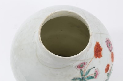 Lot 43 - Antique Chinese Qing period semi-eggshell porcelain vase with a textured surface, decorated in a famille rose palette with two hoho birds in a stream, surrounded by flowers and foliage, 26cm height