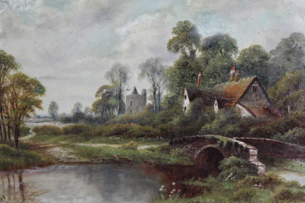 Lot 190 - Walter Waller Caffyn (1870-1958), oil on canvas, a river landscape with a bridge in the foreground, a farmhouse beyond, signed, 40 x 60cm