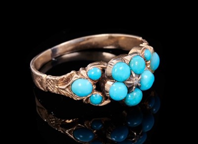 Lot 342 - Regency gold and turquoise forget-me-not ring with a central diamond chip surrounded by turquoise petals and shoulders, glazed locket compartment to the reverse, on plain shank. Finger size K.