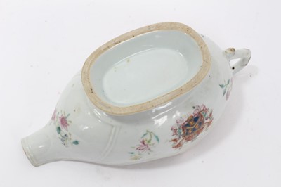 Lot 59 - Antique 18th century Chinese famille rose Armorial porcelain sauce boat, the armorial painted on both sides, the motto faded but appears to read 'Mea Fides Gloria', adorned with floral sprays, 24cm...