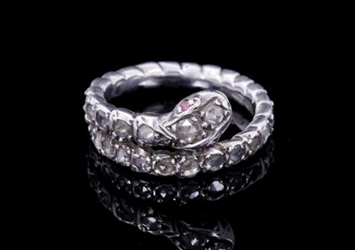 Lot 347 - Antique diamond snake ring with two ruby eyes and a body of rose cut diamonds in silver collet setting, ring size approximately K.